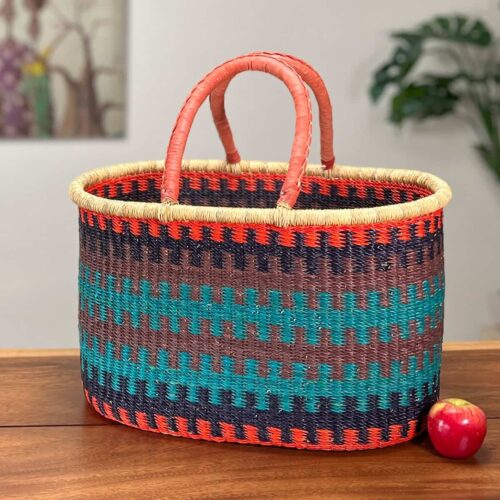 Colorful XL Oval Basket next to an apple