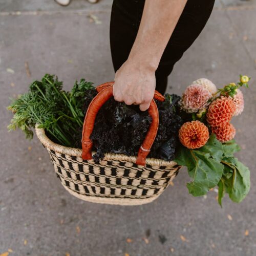 View of Flowers coming out of an African woven basket