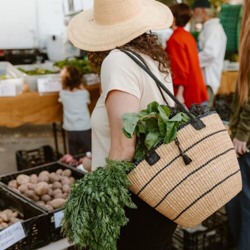 Woman Shopping with an Woven Shoulder Bag