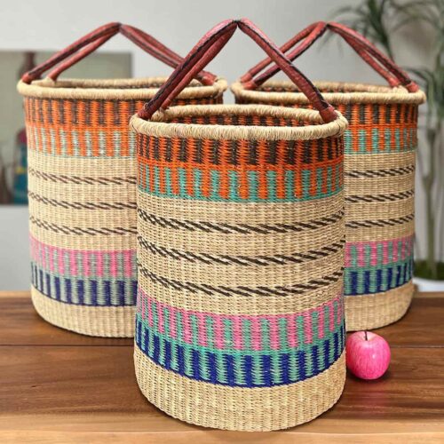 Set of Three Woven Laundry Baskets next to an apple
