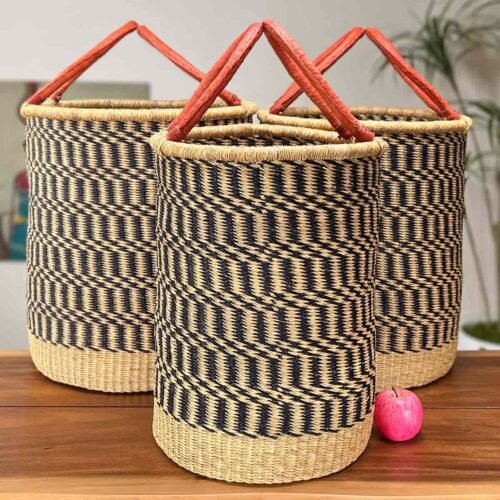 Set of Three Woven Laundry Baskets next to an apple