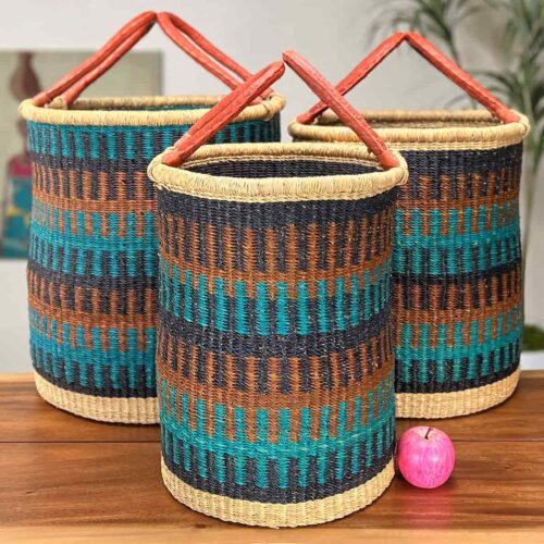 Set of Three Woven Laundry Baskets next to an apple