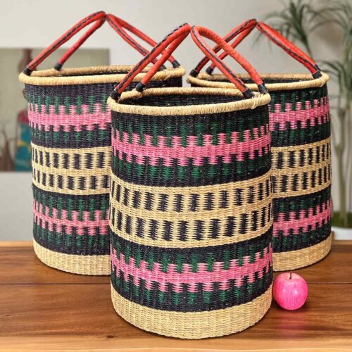 Set of Three Woven Laundry Baskets next to an apple