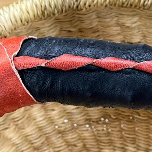 Detail of dark handle on a Natural Small Round Market Basket
