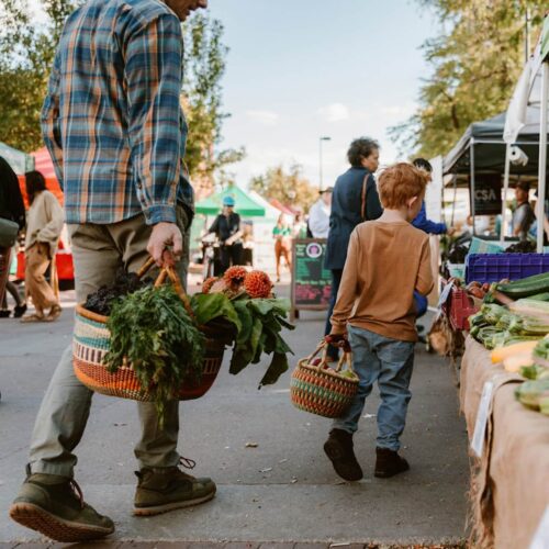 Father and Son shopping with Colorful Round African market baskets