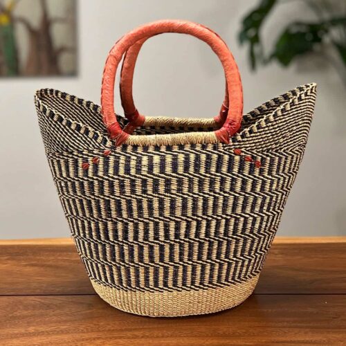 Shopping Tote Bolga Basket next to an apple