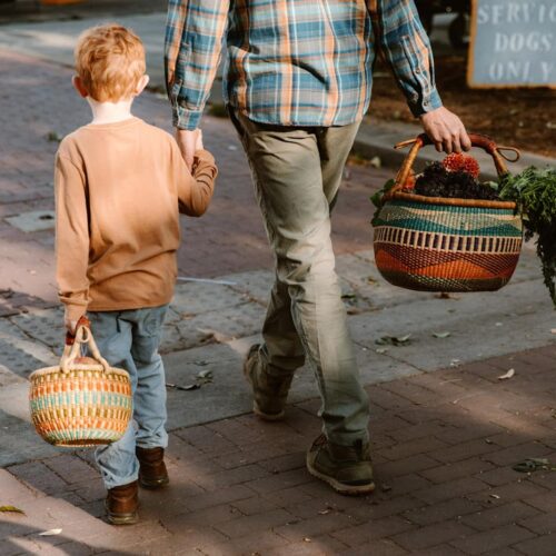 Father and son walking with Colorful Round Market Baskets